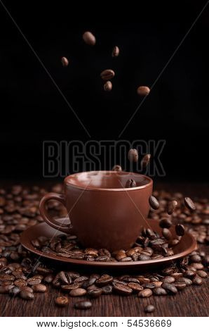 Coffee Beans Flow In A Cup