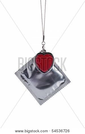 Condom With Chain And Heart. Isolated On White
