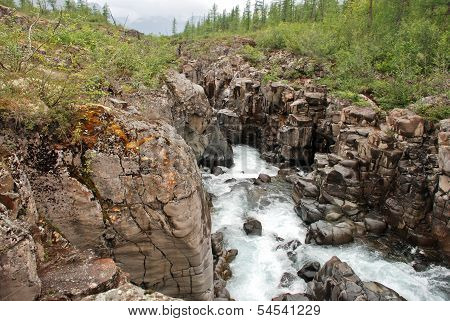 Waterfall In The Rocks