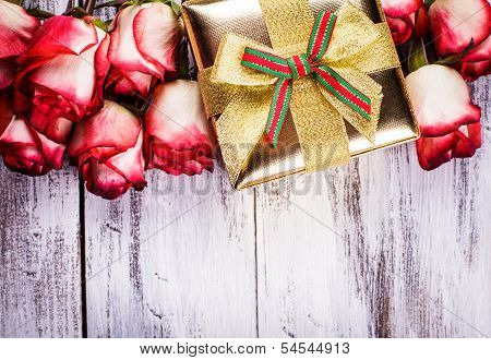 Gift box and bouquet of roses