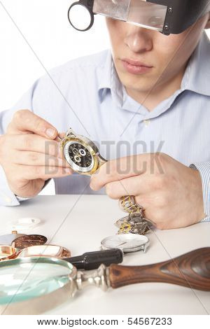 Watchmaker. Watch repair craftsman repairing watch 
