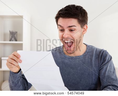 Exultant Young Man Cheering Good News