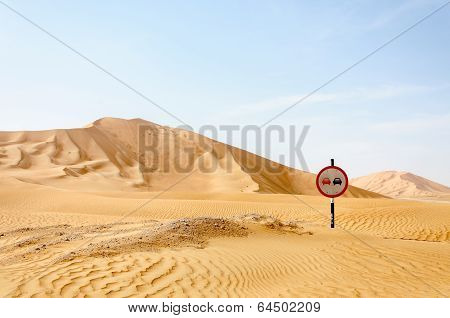 Road Sign Among Sand Dunes In Desert (oman)