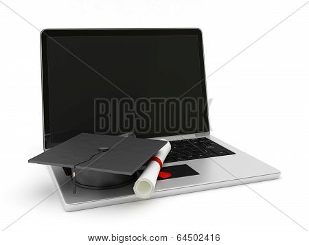 Laptop on diploma and cap