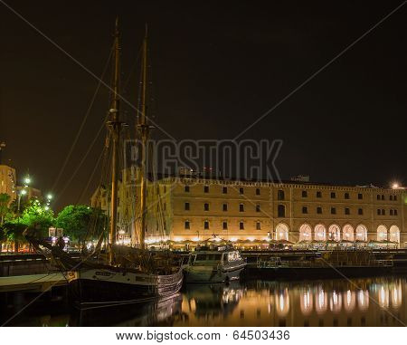 Night Embankment with the ship to the Port Olimpik in Barcelona, Spain