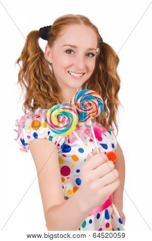Redhead young girl with lolipops isolated on white