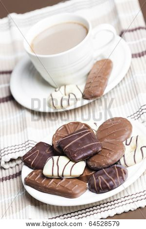 cup of coffee with chocolete biscuits