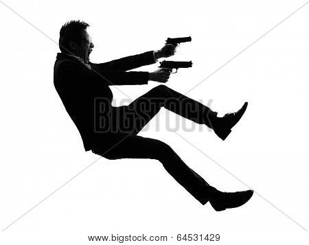 one asian gunman killer jumping shooting in silhouette isolated white background