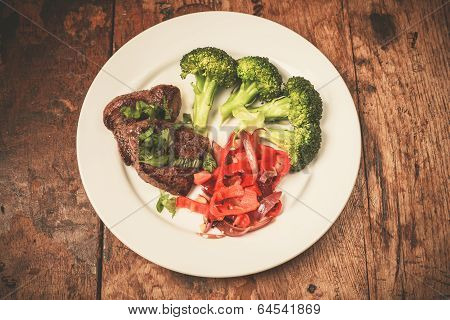 Meat And Vegetables On Plate