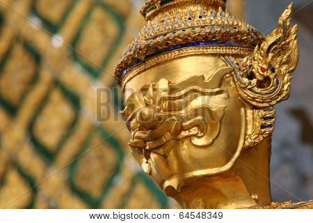 Golden Buddhistic statue in a temle