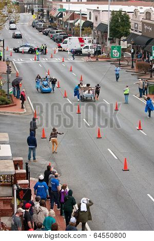 Two Teams Race Beds On City Street In Fundraiser Event
