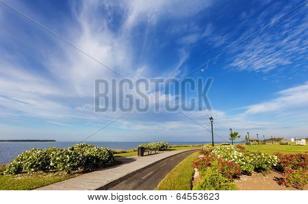 Waterfront and boardwalk with a paved bike trail along the harbor in Summerside, Prince Edward Island, Canada.