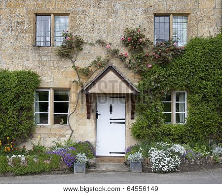 Cotswold Cottage Facade with Flower Border