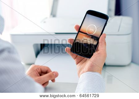 Man sending a photo to printer.