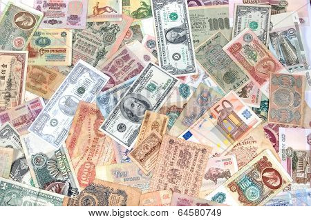 Many coins , banknotes of different countries and times. Money.