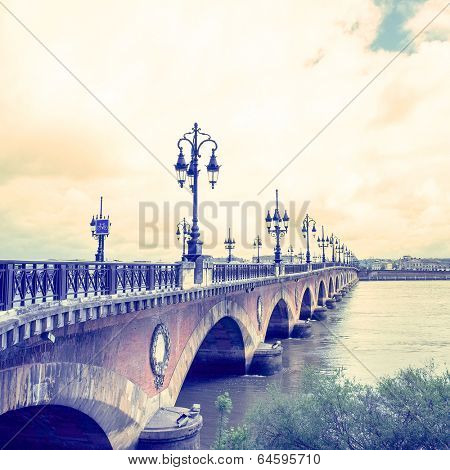 Old stony bridge in Bordeaux, France Europe