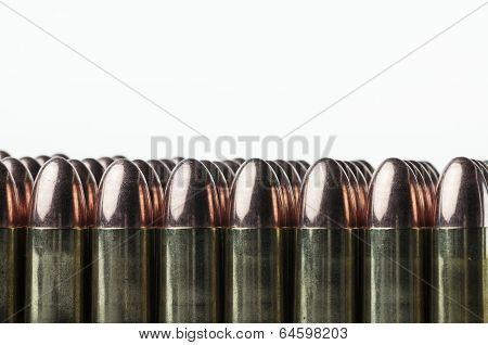Lined up 9 mm bullet cartridges