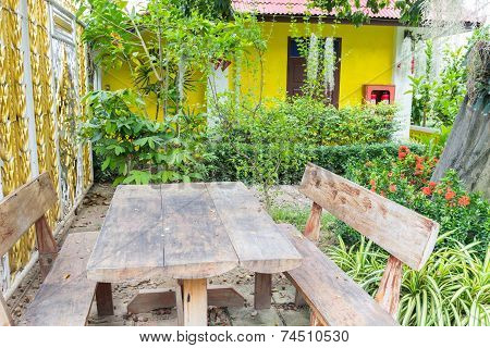 The Old Wooden Table And Chair In The Garden