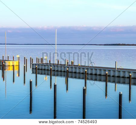 Sunset In Zinnowitz With Reflection On The Water