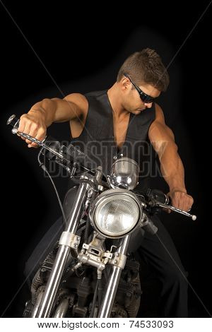 Man On Motorcycle Black Vest Dark Glasses Look Down
