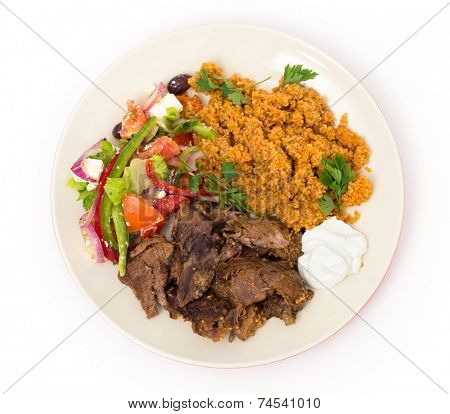 roast lamb kuzu tandir, served with bulgur pilaf and a tossed Turkish salad, all mainstays of Ottoman cuisine