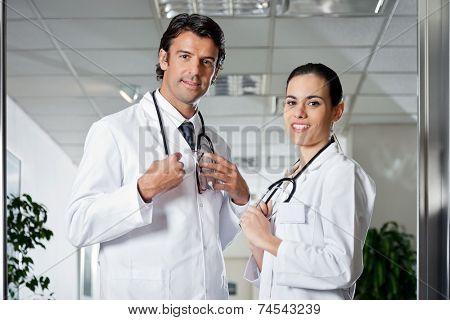 Portrait of multiethnic medical professionals smiling while standing together