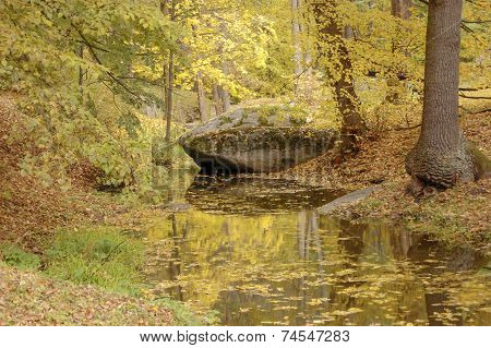 Large Stone Lying Near A Creek