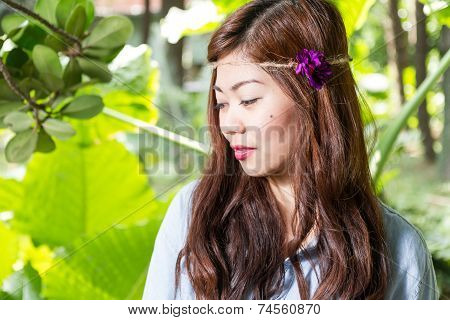 Filipina Woman In A Garden