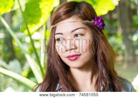 Filipina Woman In A Garden