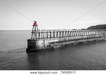 Scenic view of Whitby Pier in sunny autumn day, UK