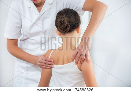 Chiropractor doing adjustment on female patient