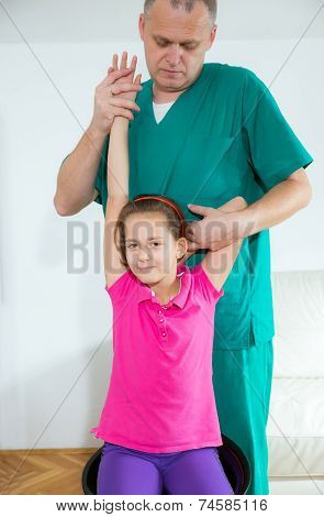 Chiropractor doing adjustment on female patient
