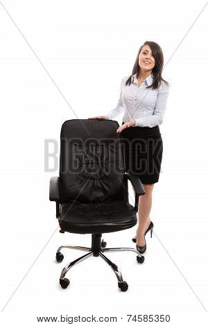 Businesswoman inviting to sit on an office chair - isolated