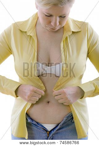 overweight woman trying to fasten too small  clothes