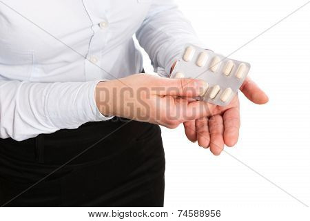 Women pouring medicine into hand