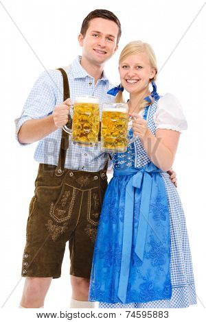 happy bavarian couple in dirndl with oktoberfest beer