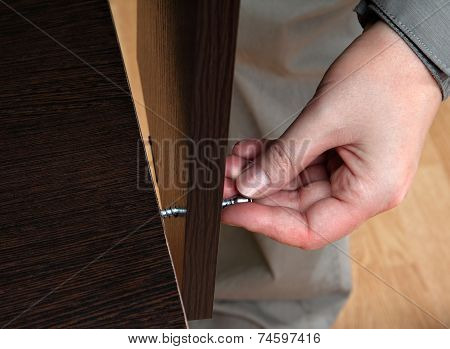 Hand Screws In A Hole Chipboard, Furniture Assembly Manually.
