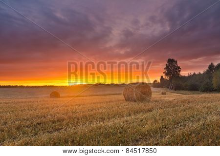 Straw Bales On Field Against Sky