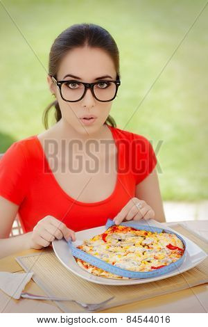 Surprised Woman Measures Pizza with Measure Tape