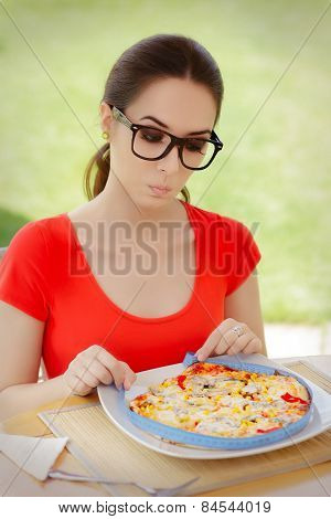 Surprised Woman Measures Pizza with Measure Tape