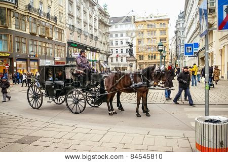 Two Horses Harnessed To The Carriage