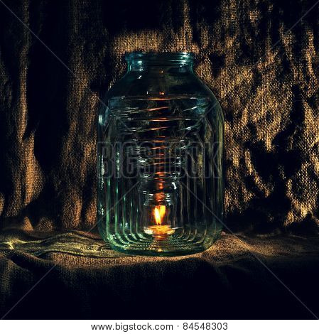 bottle. burning candle