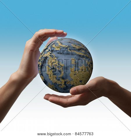 globe in the hands against the blue sky day environment