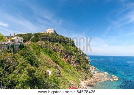 View of the bay and fortress on a rock, Tuscany, Italy