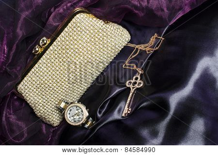 Set Of Women's Accessories On A Silk Background