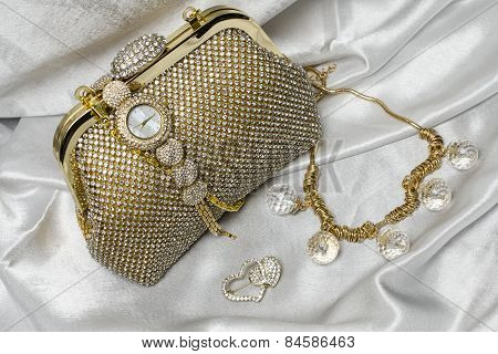Set Of Women's Accessories On A White Silk Background