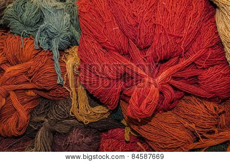 Colorful threads for sale in a stand