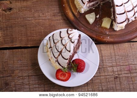 Pie Of Pancho From A Chocolate Biscuit And The Pineapple Slices, Decorated With The Swept Away Cream