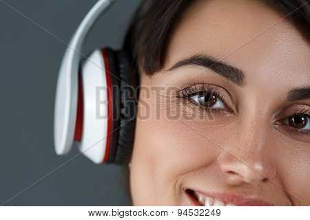 Beautiful Dark Haired Smiling Woman Wearing Headphones