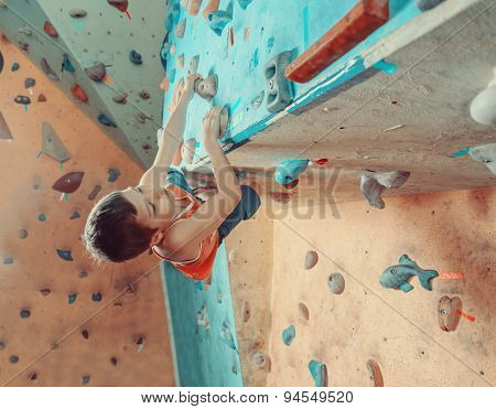 Boy Climbing In Gym